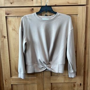 Extremely soft sweatshirt with knotted feature at waist.